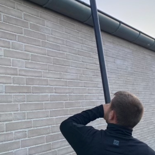 Tagrenderens med støvsuger